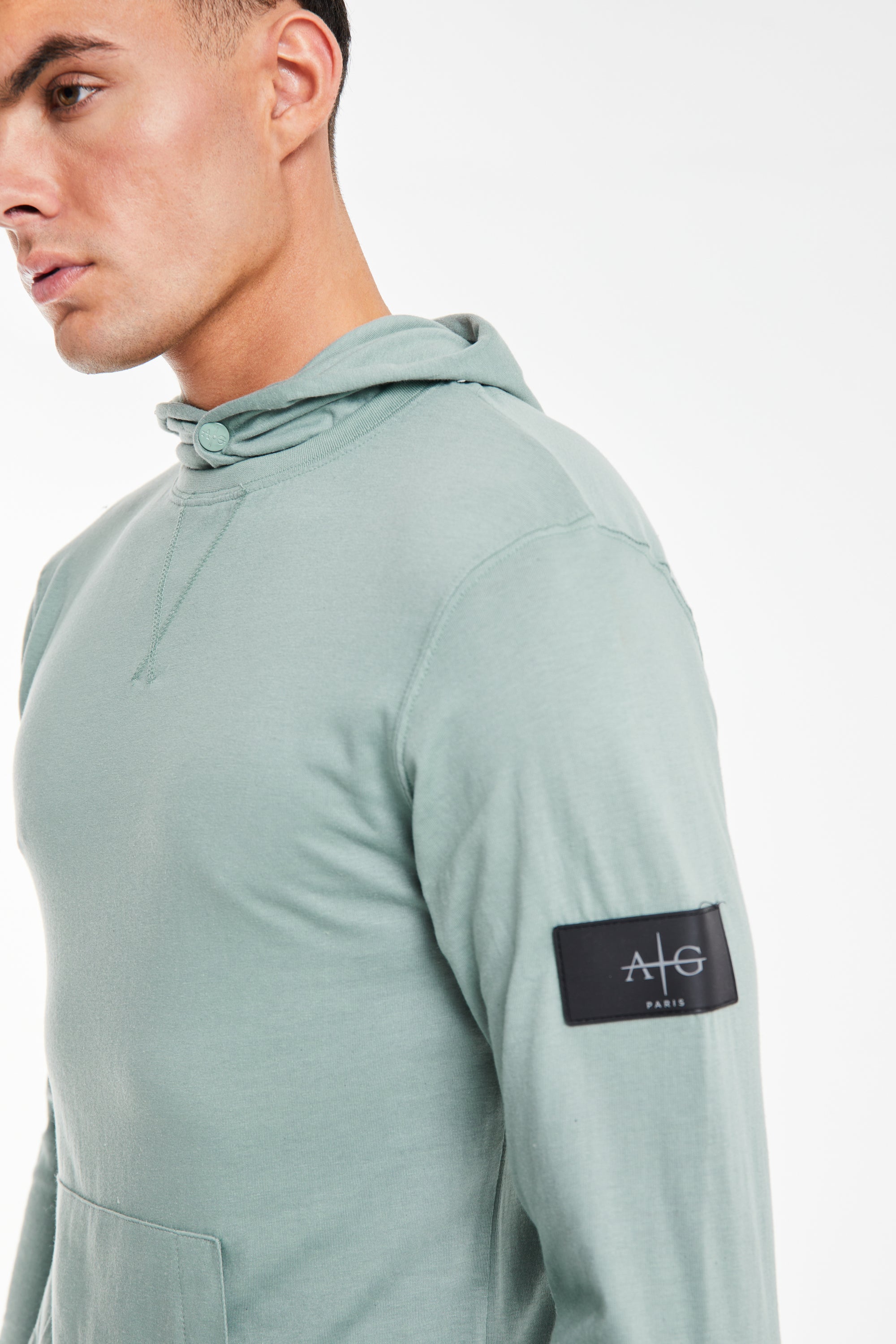 close up showing the &#39;Avant Garde Paris&#39; logo on a cheap mens hoodies in light green