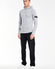 side profile of model wearing light grey marl cheap hoodies