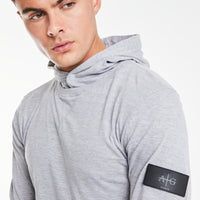 close up of 'Avant Garde Paris' logo on plain hoodies in light grey