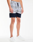 side profile of mens coords set shorts with a navy pattern 