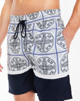 close up of men's co ord shorts in navy blue and white