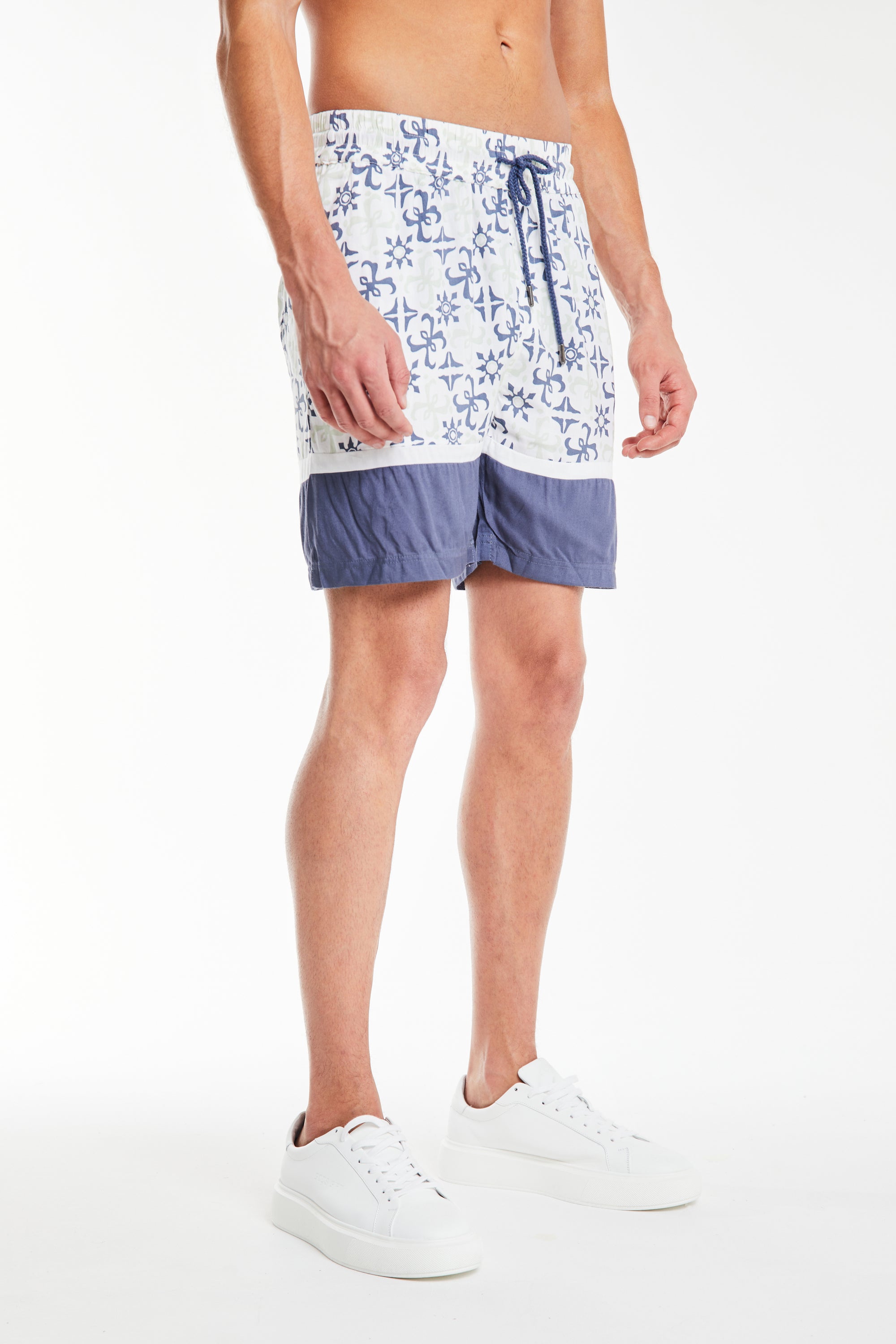 side profile of the shorts in a mens co ord with a baby blue pattern