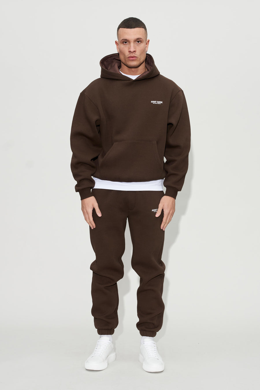 Model wearing creatives hoodie and joggers in chocolate